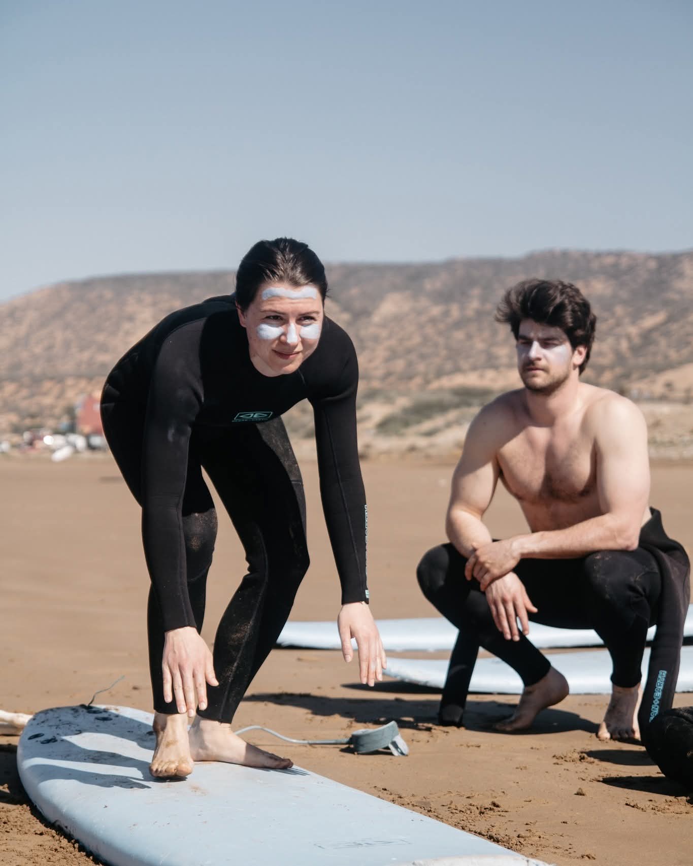 Surf instructor teaching at Tamazirt Surf Shop School Taghazout
